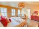 Spacious main bedroom with hardwood floors, sitting area, and decorative lighting at 2557 Avery Park Cir, Atlanta, GA 30360