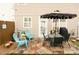 Outdoor patio area with a dining set, comfortable seating, and a well-maintained grill, perfect for entertaining at 2557 Avery Park Cir, Atlanta, GA 30360