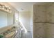 Renovated bathroom with granite counters, modern fixtures and tiled walk-in shower at 3009 Bruce Nw Ct, Acworth, GA 30101
