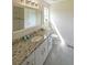 Bathroom featuring granite counters, tile flooring, white cabinetry and ample lighting at 3009 Bruce Nw Ct, Acworth, GA 30101