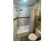 Updated bathroom with marble-like shower wall, tub, and decorative shelving at 3009 Bruce Nw Ct, Acworth, GA 30101
