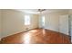 Spacious bedroom with hardwood floors, a ceiling fan and an adjacent bathroom at 3009 Bruce Nw Ct, Acworth, GA 30101