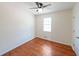 Clean and simple bedroom featuring hardwood floors, neutral paint, and a ceiling fan at 3009 Bruce Nw Ct, Acworth, GA 30101