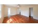 Bright bedroom featuring hardwood floors, ceiling fan, and access to bathroom and closet at 3009 Bruce Nw Ct, Acworth, GA 30101