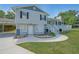 Home exterior showcasing a cozy front porch, landscaped yard, and convenient carport at 3009 Bruce Nw Ct, Acworth, GA 30101