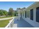 Inviting front porch with white railings and classic black shutters on a well-maintained home at 3009 Bruce Nw Ct, Acworth, GA 30101