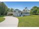 Charming two-story home featuring a spacious yard, attached carport, and inviting front porch at 3009 Bruce Nw Ct, Acworth, GA 30101