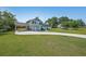 View of the home showcasing the well-maintained lawn, driveway, and attached carport at 3009 Bruce Nw Ct, Acworth, GA 30101