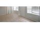 Bright living room features tile floors, natural light from windows, and closet for storage at 3009 Bruce Nw Ct, Acworth, GA 30101