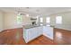 Large kitchen island anchoring a well-lit living space with hardwood floors and classic finishes at 3009 Bruce Nw Ct, Acworth, GA 30101