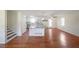 Open-concept living area featuring hardwood floors, a kitchen island, and bright natural light at 3009 Bruce Nw Ct, Acworth, GA 30101