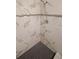 Walk-in shower featuring mosaic accent tile and hexagon tile flooring at 3009 Bruce Nw Ct, Acworth, GA 30101