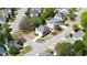 Aerial view showcases the home's location in a well-planned neighborhood with mature trees and landscaping at 5395 Fontenoy Ct, Peachtree Corners, GA 30071