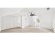 View of carpeted attic or bonus room with vaulted ceilings and a ceiling fan at 5395 Fontenoy Ct, Peachtree Corners, GA 30071
