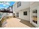 Wooden back deck features white siding and views of backyard at 5395 Fontenoy Ct, Peachtree Corners, GA 30071