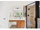 Bright bathroom features double sink vanity and glass shower at 5395 Fontenoy Ct, Peachtree Corners, GA 30071