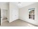 Bedroom with neutral carpet, a ceiling fan, natural light, and closet at 5395 Fontenoy Ct, Peachtree Corners, GA 30071