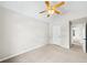 Bright bedroom featuring neutral carpet, ceiling fan, vaulted ceiling, and neutral walls at 5395 Fontenoy Ct, Peachtree Corners, GA 30071