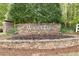 Stone Wynntree community entrance sign surrounded by landscaping at 5395 Fontenoy Ct, Peachtree Corners, GA 30071