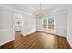 Dining room features wood floors, chandelier, molding, and windows at 5395 Fontenoy Ct, Peachtree Corners, GA 30071