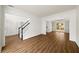 Spacious foyer with hardwood staircase, chandelier, and open floor plan at 5395 Fontenoy Ct, Peachtree Corners, GA 30071