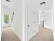 Upstairs hallway area showcasing carpet flooring, neutral walls and staircase at 5395 Fontenoy Ct, Peachtree Corners, GA 30071