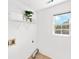 Bright laundry room featuring open shelving, a window and tile floor at 5395 Fontenoy Ct, Peachtree Corners, GA 30071
