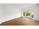 Bright living room featuring bay window and hardwood floors at 5395 Fontenoy Ct, Peachtree Corners, GA 30071