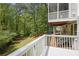 View from the deck overlooking the wooded backyard and outdoor fire pit at 2794 Kakki Ct, Marietta, GA 30062