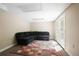 Finished basement area featuring a comfortable sofa and walkout access to backyard at 2794 Kakki Ct, Marietta, GA 30062