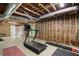 Spacious unfinished basement area with exposed ceiling, exercise equipment, and walkout to backyard at 2794 Kakki Ct, Marietta, GA 30062