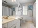 Well-lit bathroom featuring a white vanity, a large mirror, and a shower-tub combo at 2794 Kakki Ct, Marietta, GA 30062
