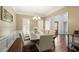 Dining room featuring hardwood floors, a modern chandelier, and access to other living spaces at 2794 Kakki Ct, Marietta, GA 30062