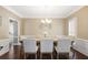 Formal dining room with hardwood floors, white wainscoting, and seating for eight at 2794 Kakki Ct, Marietta, GA 30062