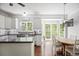Bright kitchen with white cabinets, stainless steel appliances, and a breakfast nook at 2794 Kakki Ct, Marietta, GA 30062