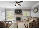 Comfortable living room with a stone fireplace and views of the backyard at 2794 Kakki Ct, Marietta, GA 30062