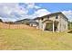 Spacious backyard featuring a covered patio perfect for outdoor entertaining and relaxation at 311 Wells Cir, Canton, GA 30114