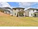 Beautiful backyard view featuring a covered patio, grassy lawn, and privacy fence at 311 Wells Cir, Canton, GA 30114