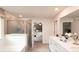 Bright bathroom featuring double sinks, a soaking tub, and a separate glass-enclosed shower at 311 Wells Cir, Canton, GA 30114
