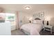 Charming bedroom with pastel decor, soft textures, and a view to the outside at 311 Wells Cir, Canton, GA 30114