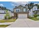 Inviting two-story home with a brick-accented facade, two-car garage, and well-manicured lawn at 311 Wells Cir, Canton, GA 30114