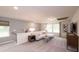 Cozy living room featuring neutral tones, plush carpeting, and plenty of natural light at 311 Wells Cir, Canton, GA 30114