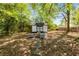 Backyard with charming shed, fire pit, and patio area at 324 Pine Ne St, Marietta, GA 30060