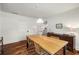 Well-lit dining room features hardwood floors, a modern light fixture, and a stylish dining set at 324 Pine Ne St, Marietta, GA 30060