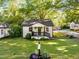 Charming bungalow features a well manicured lawn and classic architectural details at 324 Pine Ne St, Marietta, GA 30060