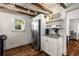 Bright kitchen with white cabinetry, stainless steel refrigerator, granite countertops, and adjacent dining area at 324 Pine Ne St, Marietta, GA 30060