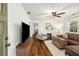 Bright living room with hardwood floors, a ceiling fan, and a stylish seating arrangement at 324 Pine Ne St, Marietta, GA 30060