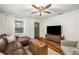 Cozy living room features hardwood floors, a ceiling fan, and plenty of natural light at 324 Pine Ne St, Marietta, GA 30060