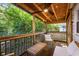 Relaxing screened porch with wood ceiling, seating, ceiling fan, and view of backyard at 324 Pine Ne St, Marietta, GA 30060