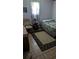Cozy bedroom with natural light, comfortable furnishings, and a warm, inviting atmosphere at 4256 Village Square Ln, Stone Mountain, GA 30083